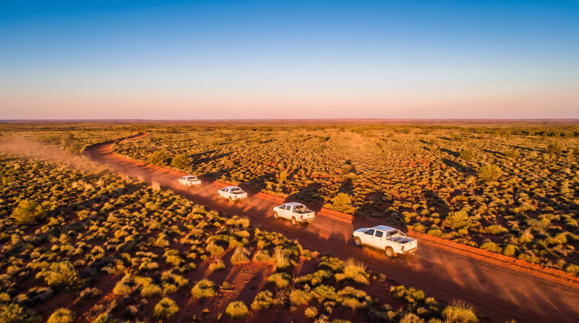 Work utes on an outback road